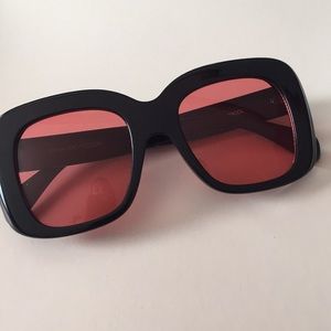 Black and red lense sunglasses
